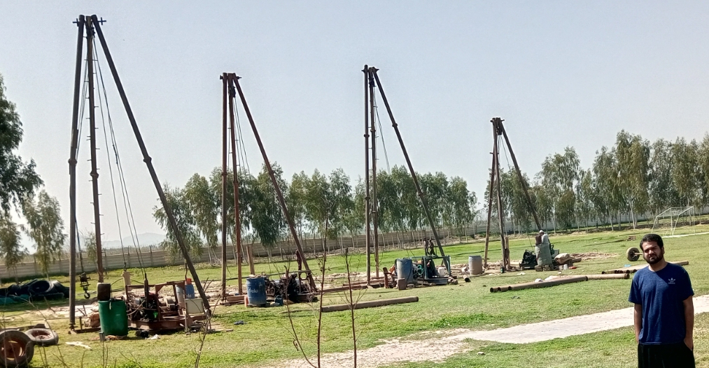 Geothermal drilling rigs operating across a project site
